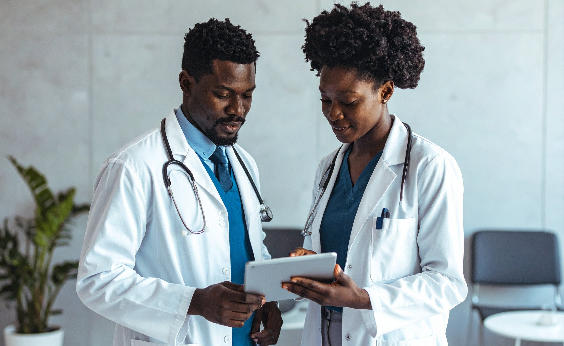 Doctors talking in waiting room Doctors using the Mediris EMR and consulting